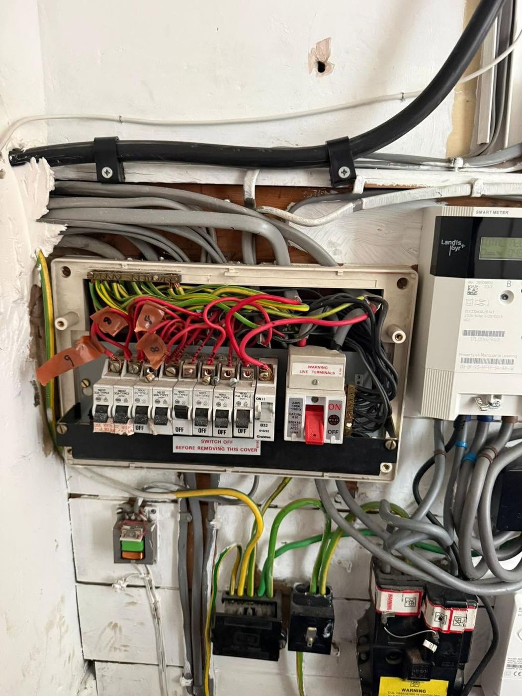 Old fuse board with no RCD protection before replacement in Leeds